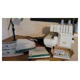 Baby lock imagine with extra surger feet & books