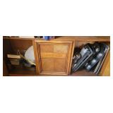 Mostly kitchen bakeware in bottom of cabinet in