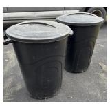 2 black garbage cans