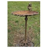 Cast iron bird bath with cherub