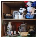 Top 2 rows over microwave - cows, blue bowl, etc