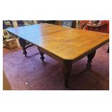 Oak claw foot table with 3 leaves opens to