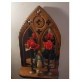 Cathedral mirror with statue and brass vases -