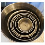 9 various sized stainless bowls.