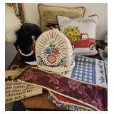 Two decorative pillows, table runner, Appliance