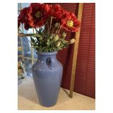 Blue double-handle vase with flowers