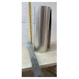 Hardware cloth and a roll of  flashing