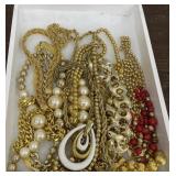 Beautiful Gold toned costume jewelry in wooden