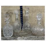 4 pretty glass decanters - wrong stopper on 1
