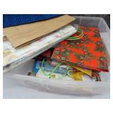 Small tote of wrapping paper and gift bags. All