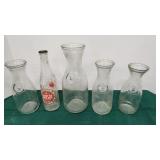 Lot of wine carafes and soda bottle