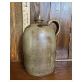 Crock jug w/handle. Has chip at the top as shown.