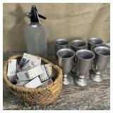 6 pewter goblets , seltzer bottle and basket of