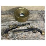 Brass over enamel spittoon and cast iron pistol