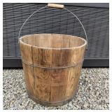 Primitive wooden bucket. One side of handle