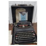 Model 5 Remington typewriter with original book