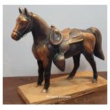 Large Copper color horse attached to wood