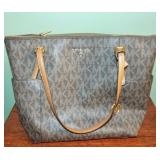 Michael Kors brown/tan logo purse. Interior