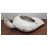 White enamelware "Headless Duck" chamber pot