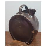 Horseshoe shaped brown jug - very cracked and