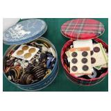 Two tins of buttons
