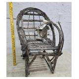 Adirondack chair with bird house