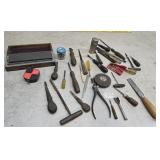 Tools - sharpening stone, tape measure, screw