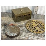 Brass trinket box, powder flask, and trivet