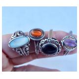 Four sterling rings with stones.