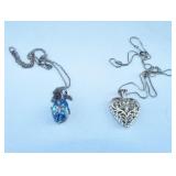 Two sterling necklaces with pendants.