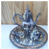 Silverplate teapot, cream & sugar on round tray