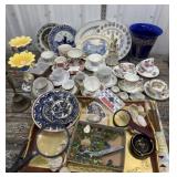 Misc. plates, cups and saucers, bell, candle