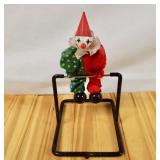 Creepy clown on cast metal frame perpetual motion