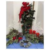 Christmas greenery, battery operated candles,