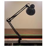 Working clamp on articulating swing arm lamp