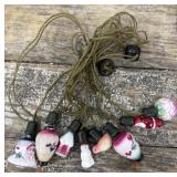 Antique string of milk glass figural lights