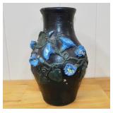Vintage pottery with clay work design of flowers