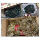 Box of string lights and gold garland