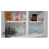 Contents of cupboard upper right of sink -