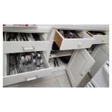 Contents of 4 drawers & double cupboard right of