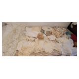 Bag of linens - many doilies, bamboo place mats,