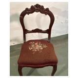Rose carved chair with needlepoint seat
