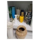 Contents of cabinet under sink - vases - some