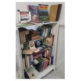 All the books in / on the white bookcase -