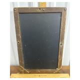 Vintage slate chalkboard with wood trim.