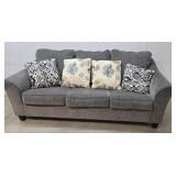 Sofa with throw pillows from clean house