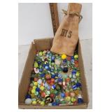 Leather bag and marbles $donated to the food