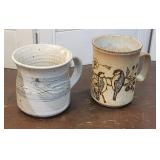 2 Studio pottery coffee mugs / signed