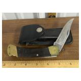 Buck 110 folding knife with sheath.