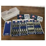Spark Plugs in a plastic bin